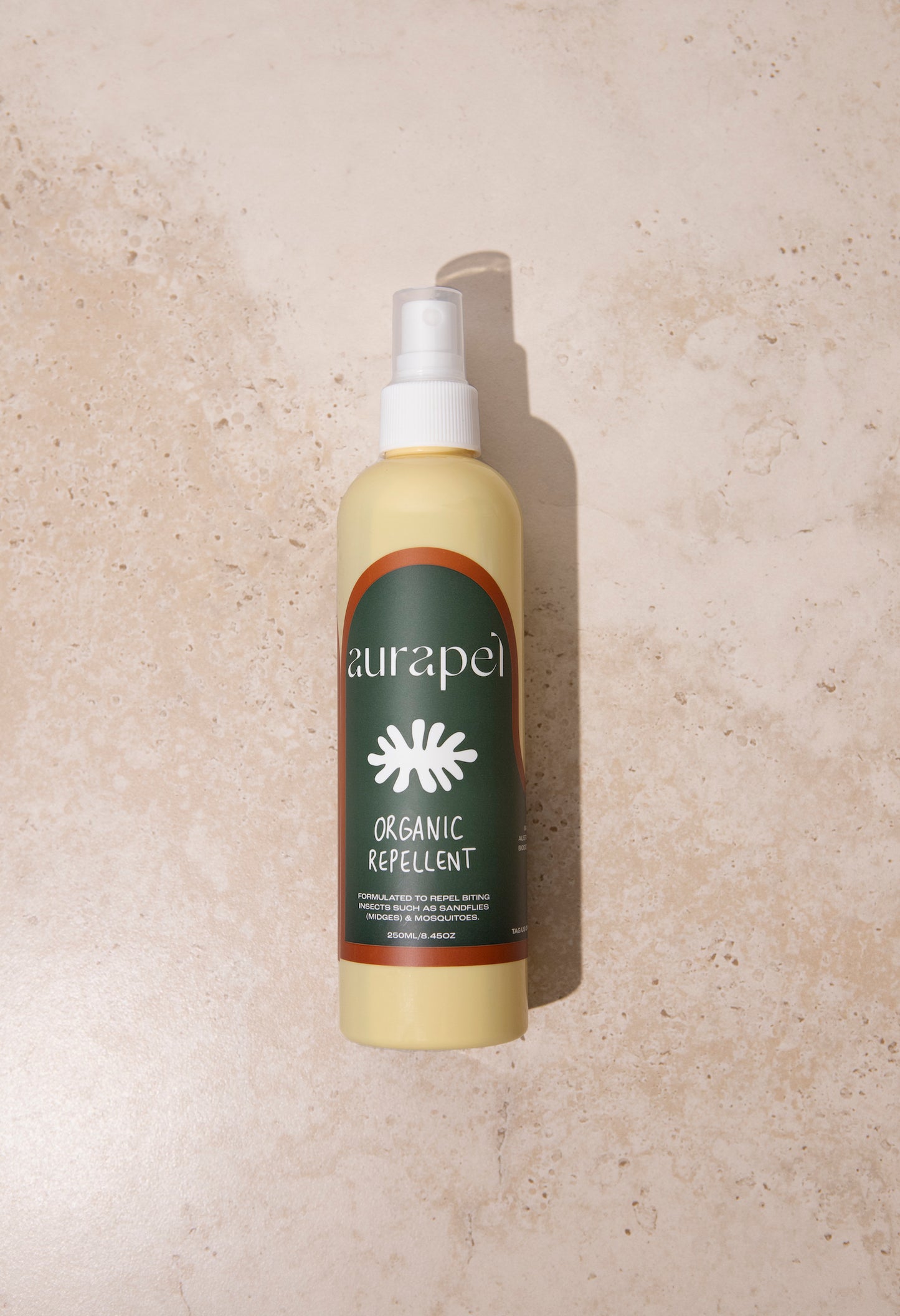 Aurapel product on textured marble background