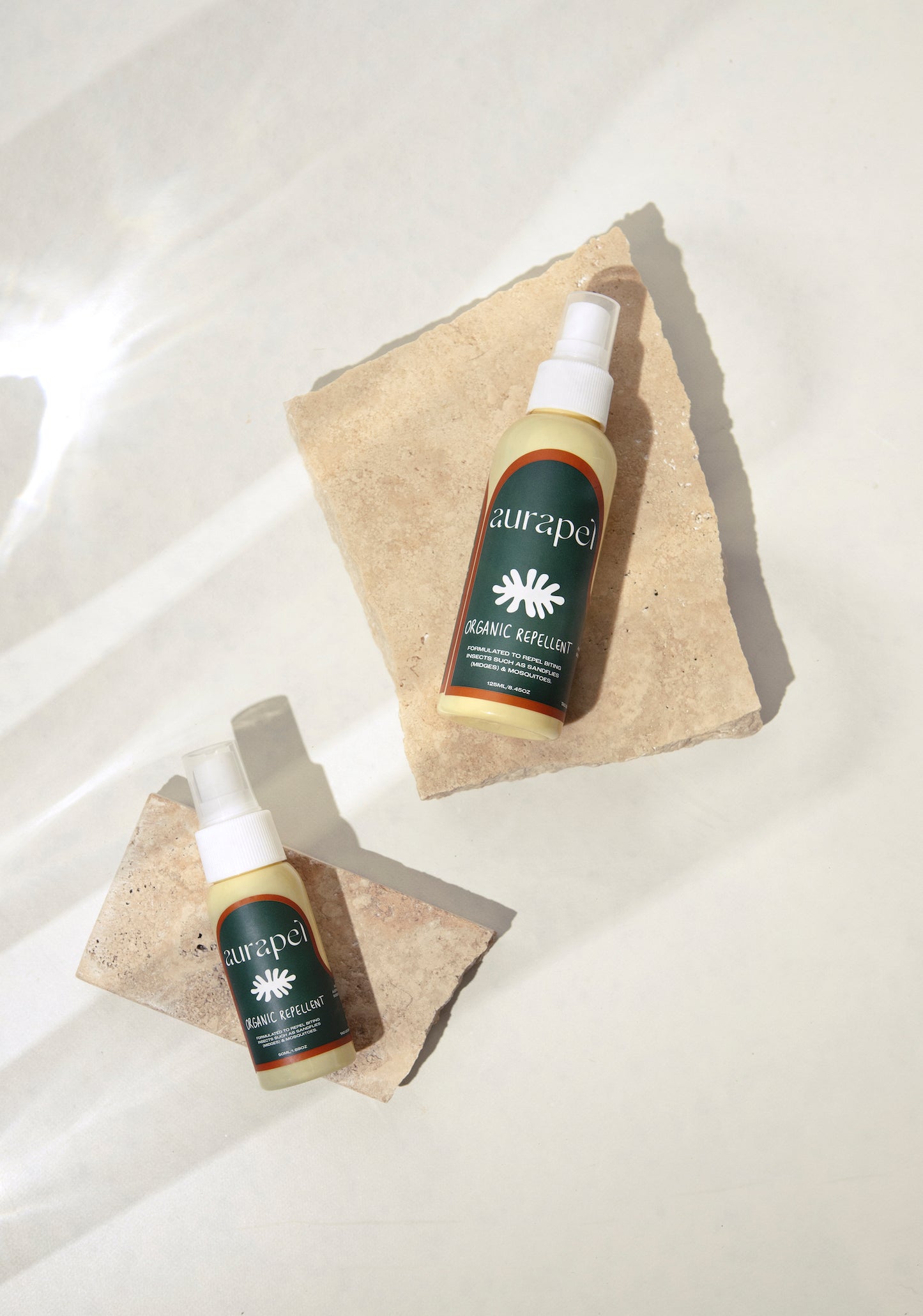 Aurapel product flatlay 50ml and 125ml