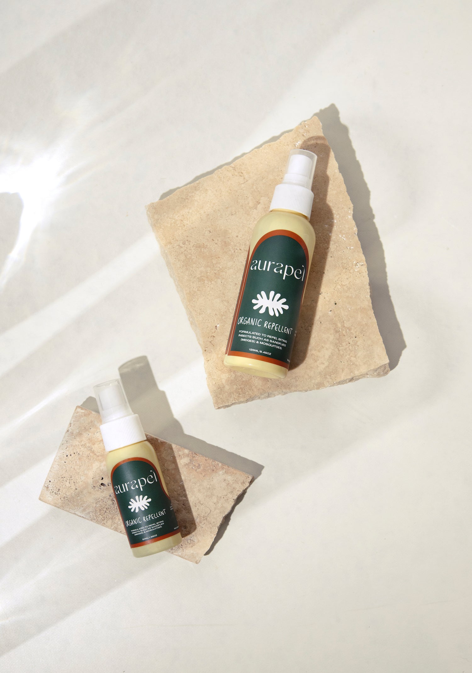 Aurapel product flatlay 50ml and 125ml