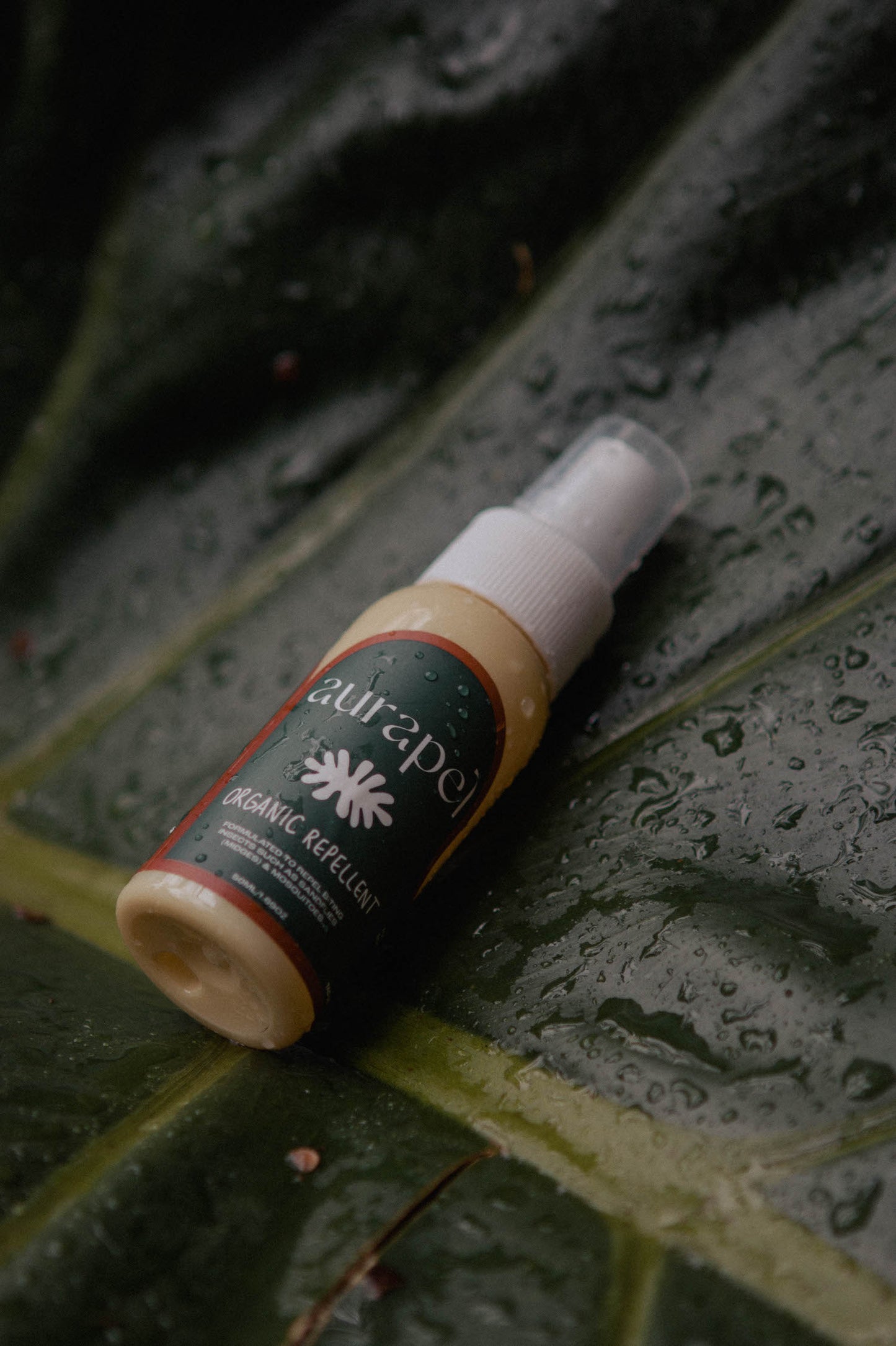 Aurapel 125ml product on dark leaves