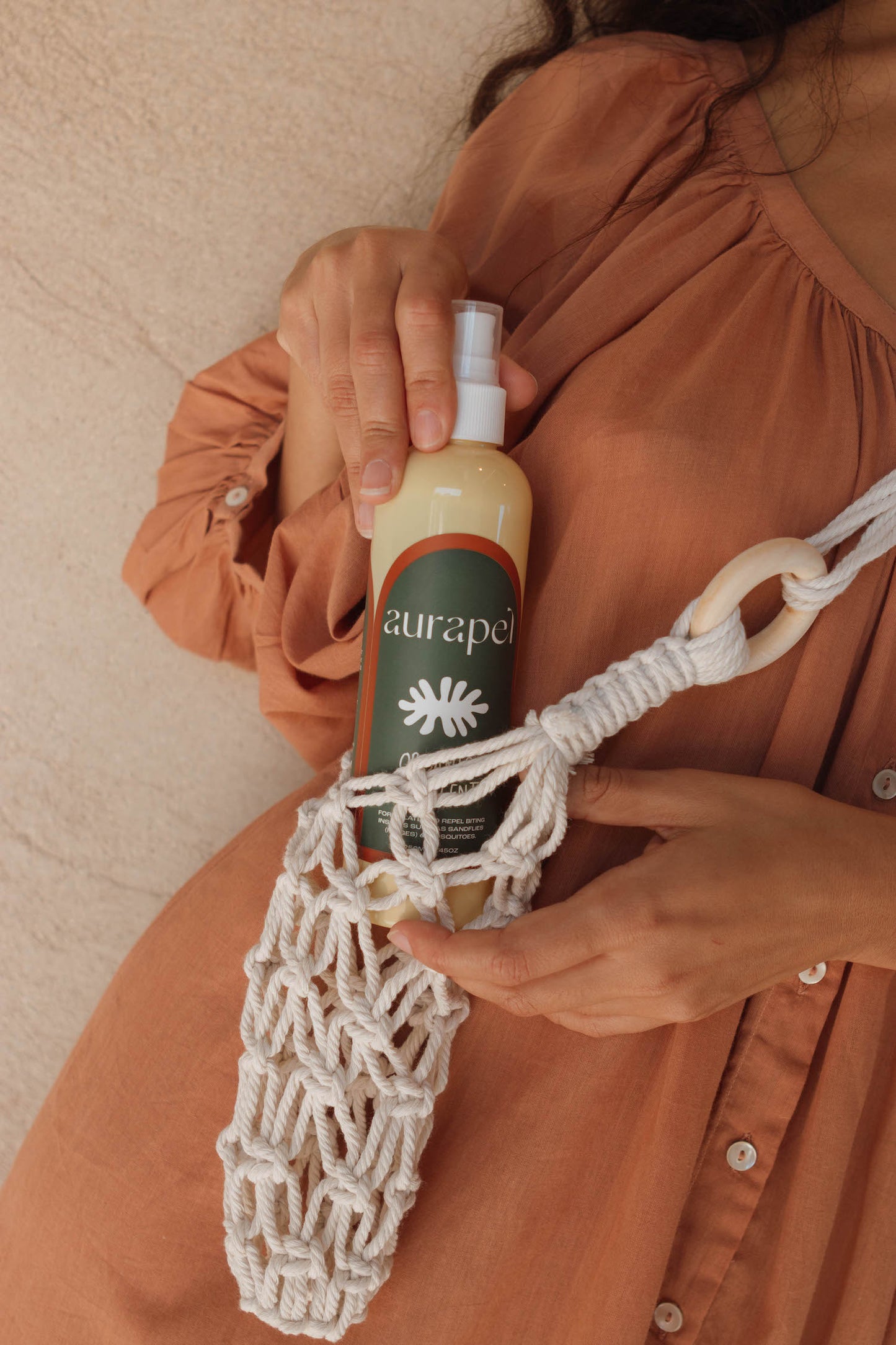 Woman holding Aurapel Macrame Bag